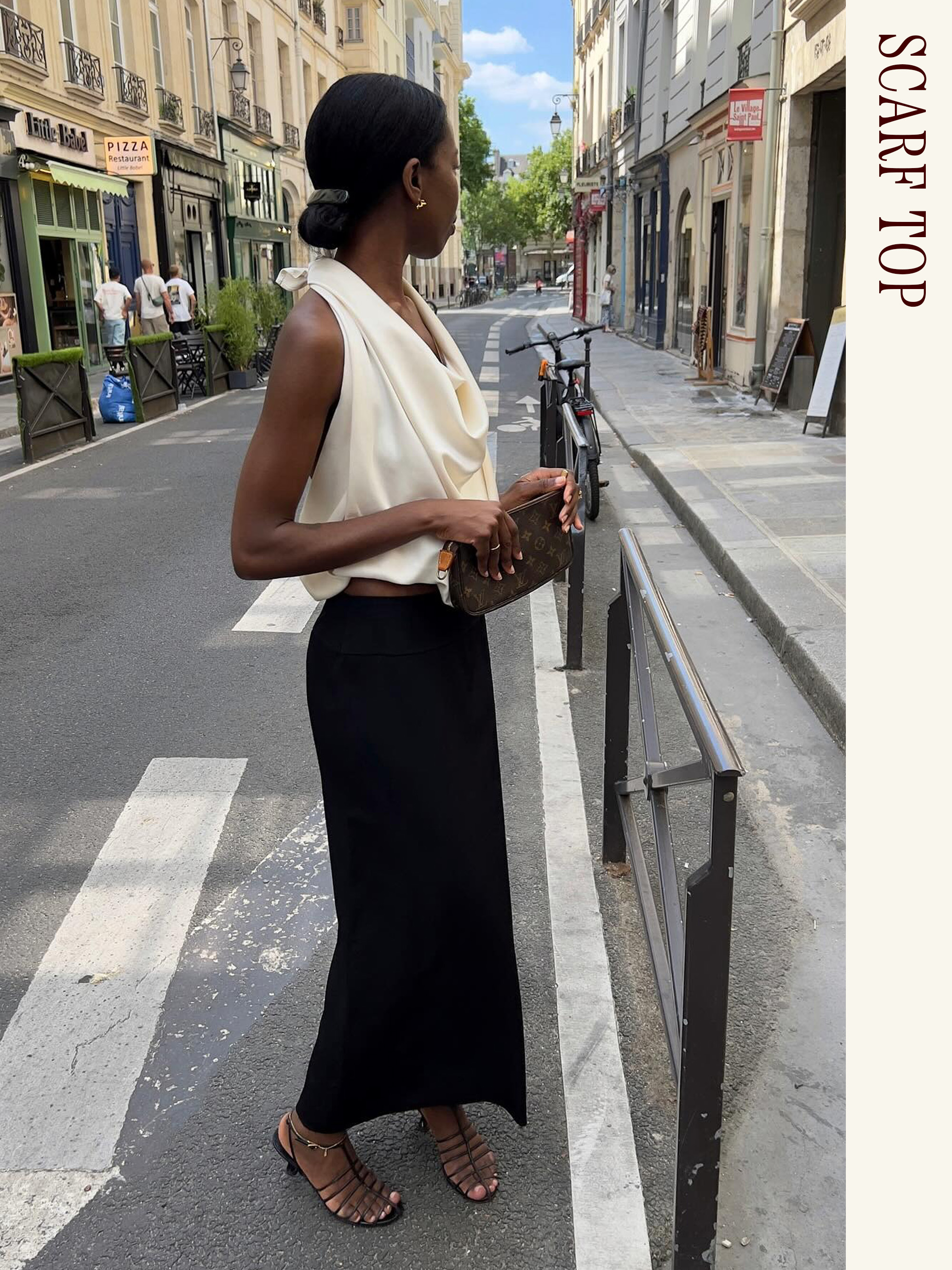 Influencer wearing a white scarf top, black maxi skirt, and sandals.
