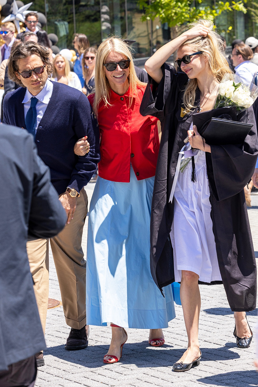 Gwyneth Paltrow wearing a red jacket over a sky blue dress with red high-heel sandals at Apple Martin's Vanderbilt University graduation.
