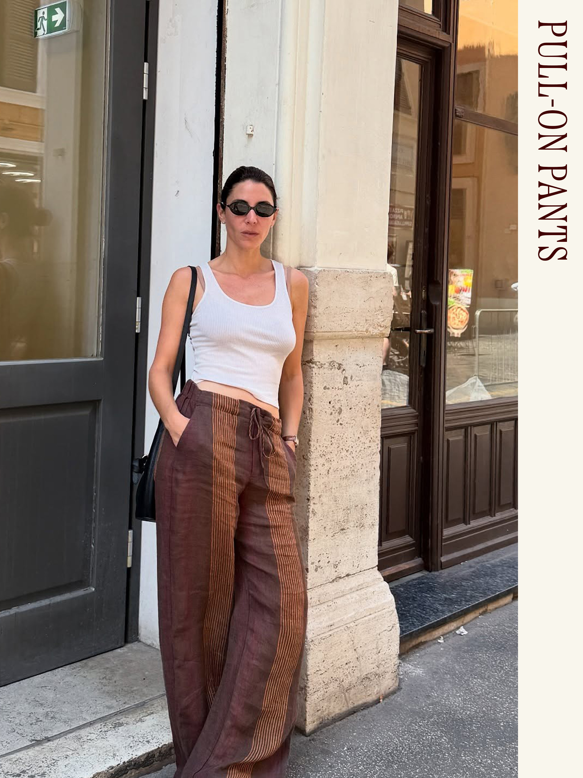 Influencer wearing a white tank and pull-on pants.