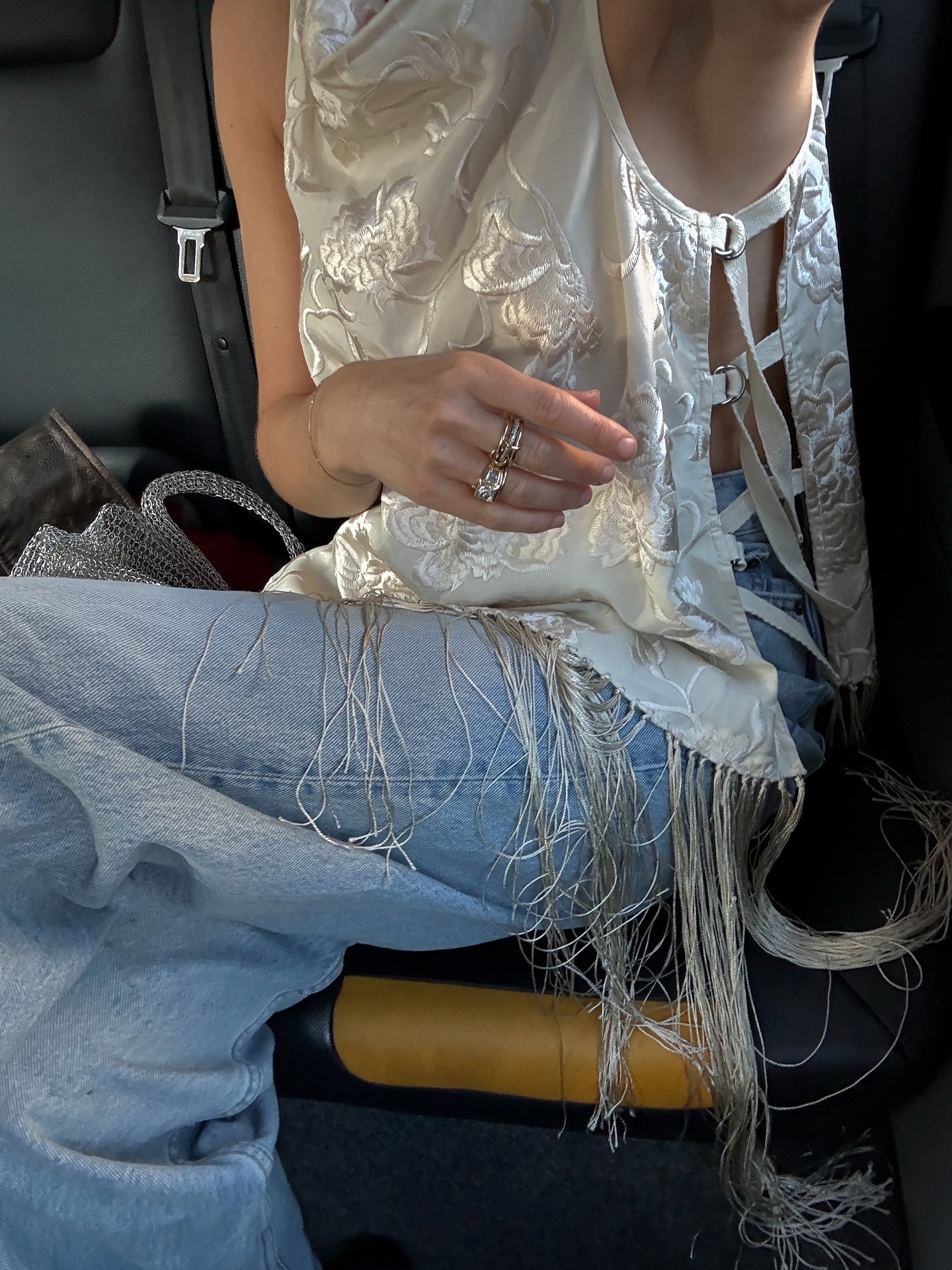 Woman in jeans and a fringe top