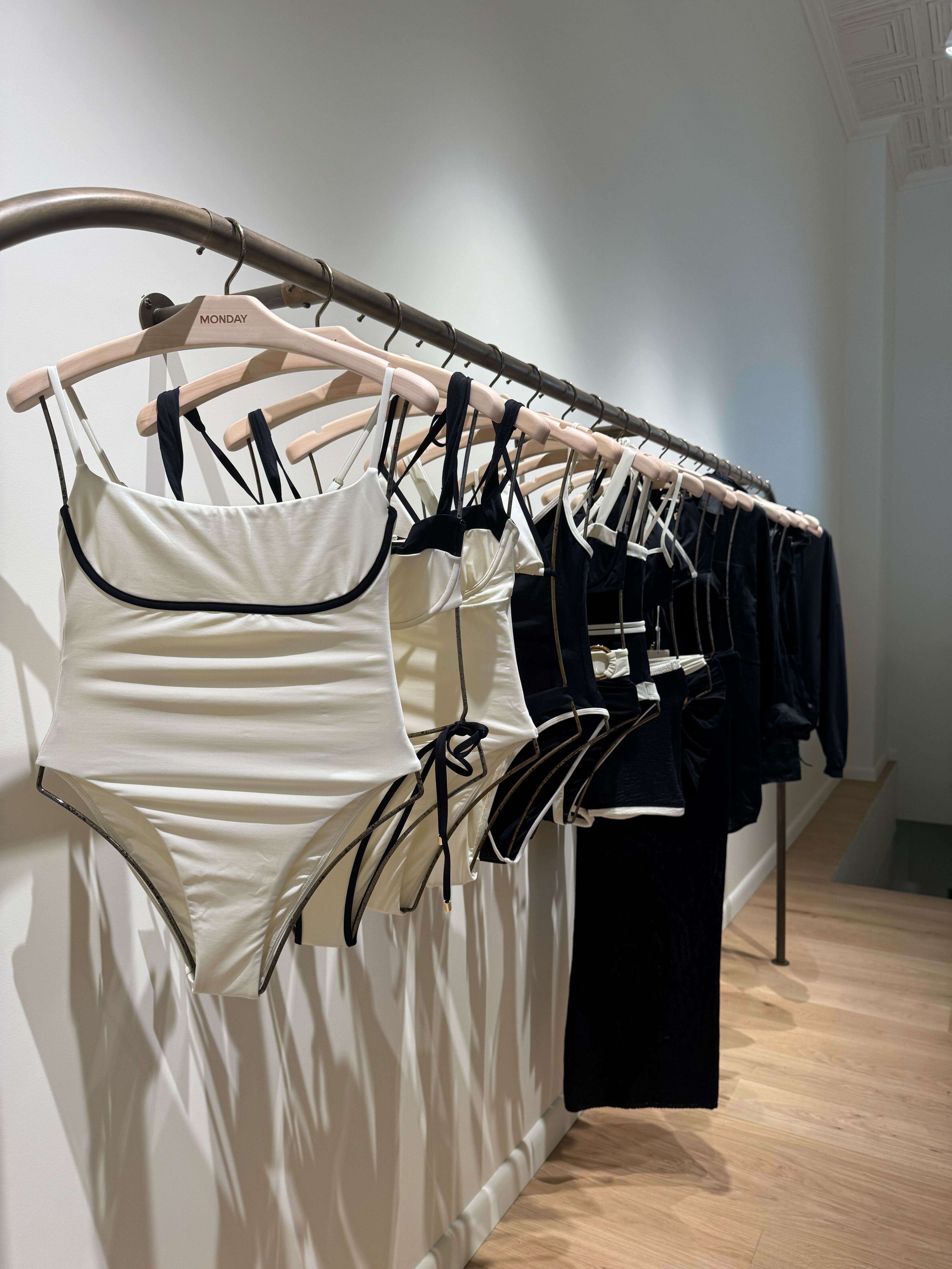 acbmboebpbgkbuekhrqvqd a picture of swimwear inside the monday swimwear nyc store.
