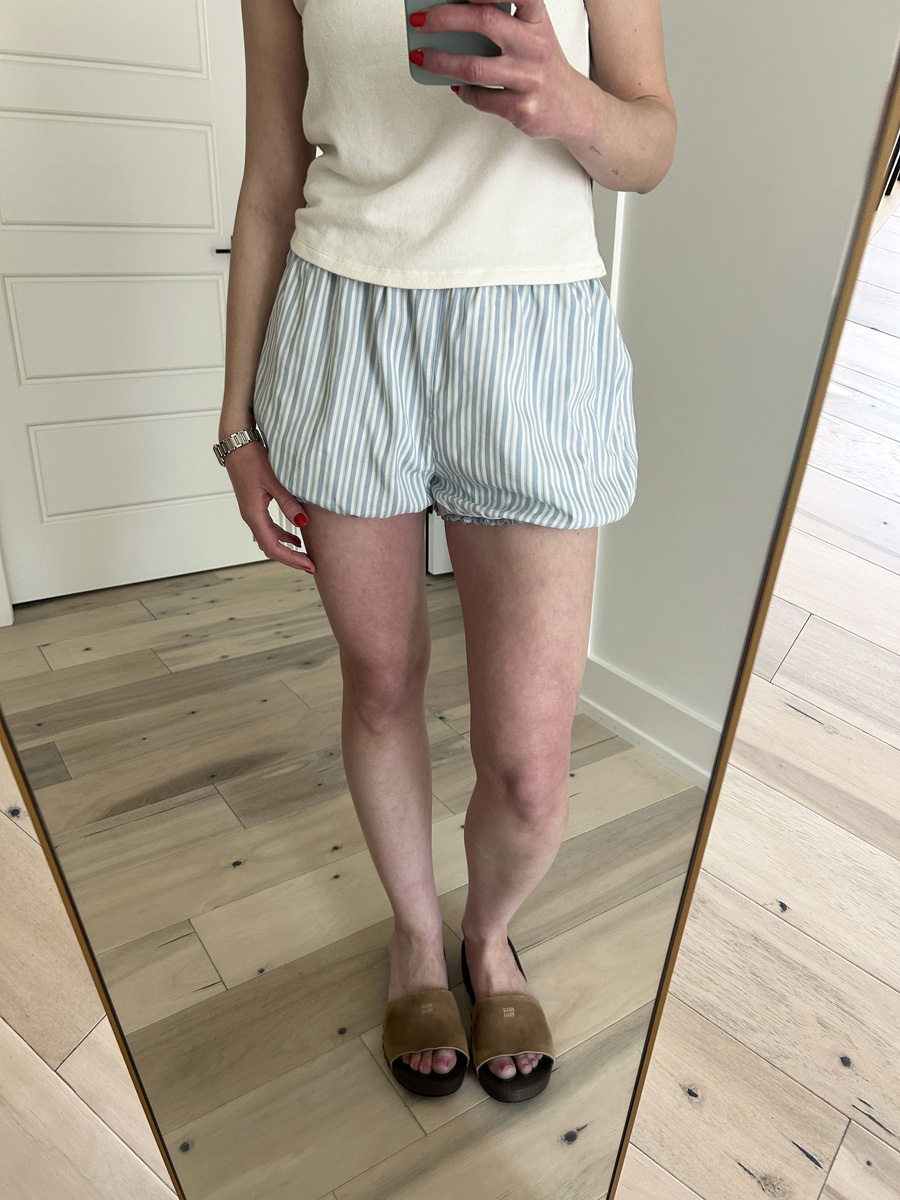 bqins3ktsld2uis2iban8l Allyson Payer trying on Reformation Sylvie Shorts.
